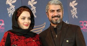 بهنوش طباطبایی با مانتو قرمز مشکی و تیپ مشکی مهدی پاکدل در جشنواره