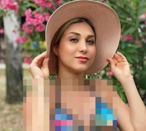 عکس بی حجاب ناهید لیان با کلاه ساحلی و تاب