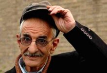 احمد پورمخبر با کلاه و کت مشکی - بیوگرافی احمد پورمخبر