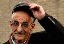 احمد پورمخبر با کلاه و کت مشکی - بیوگرافی احمد پورمخبر